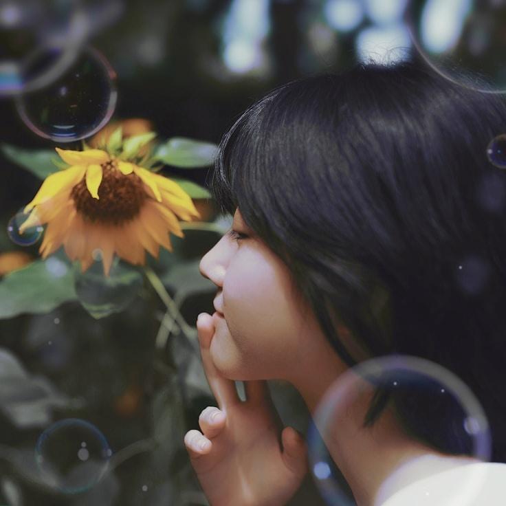 Amara Liu, Lead Design Curator at Frost Line Group, reviewing corporate floral arrangements